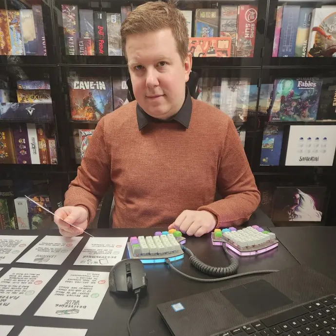Matthias Caryn A man having a custom keyboard and smiling at the camera